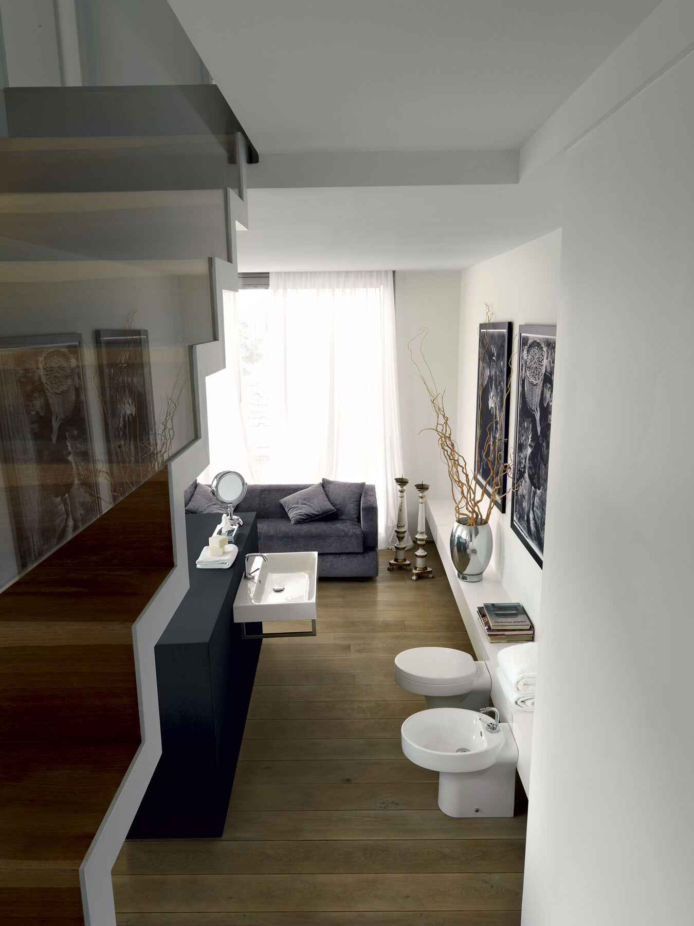 A long bathroom with twin vessel basins on a timber shelf